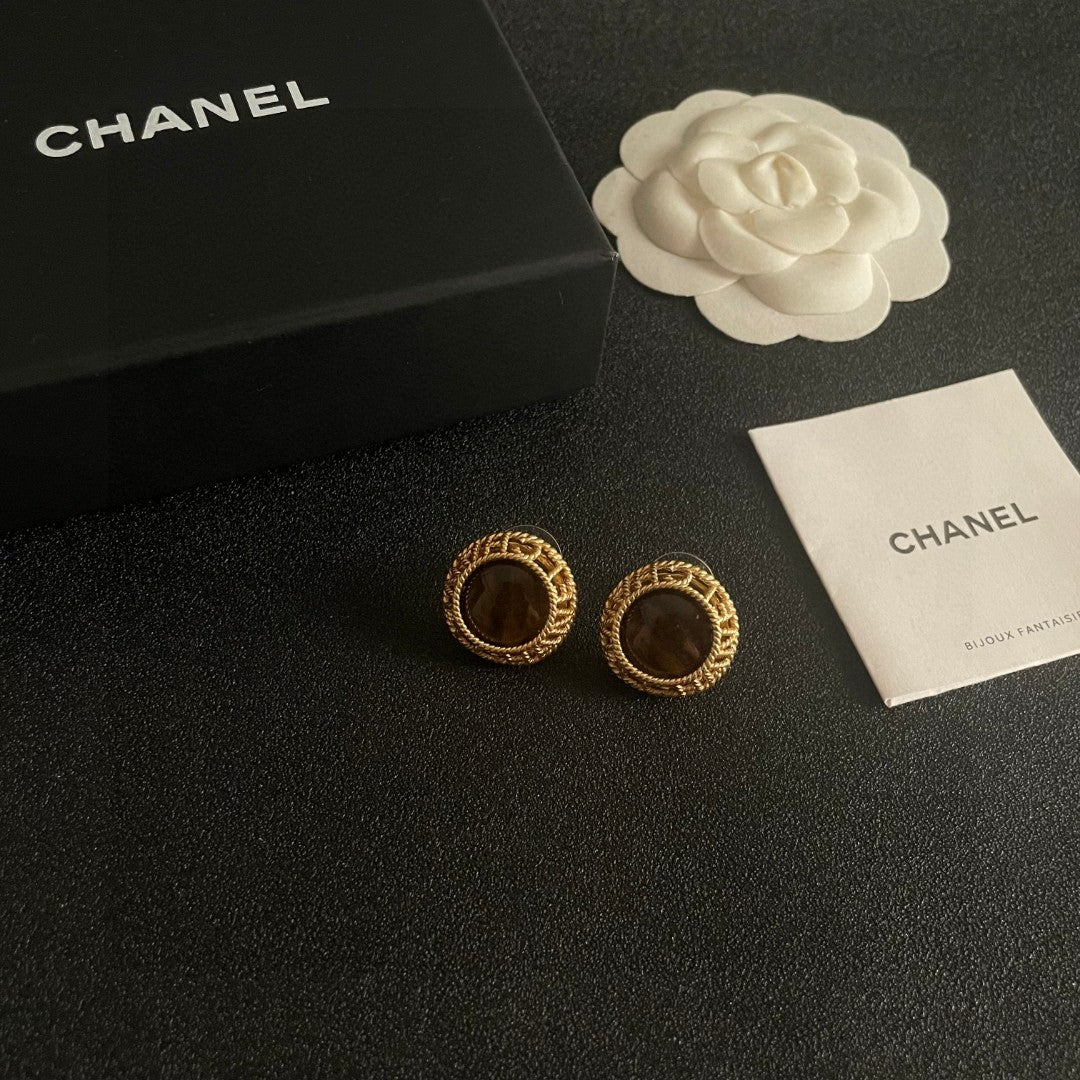 Martin Graham stud earrings in polished metal-tone – styled product view