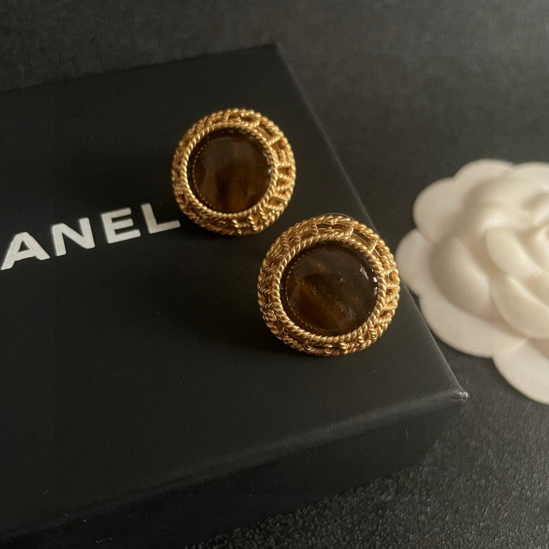 Martin Graham stud earrings in polished metal-tone – side detail