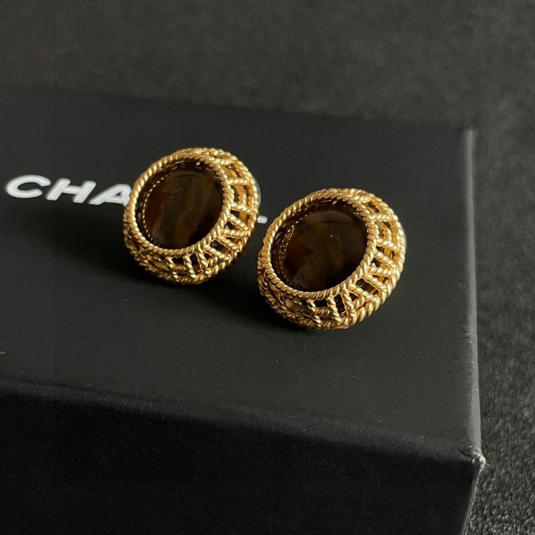Martin Graham stud earrings in polished metal-tone – front product view