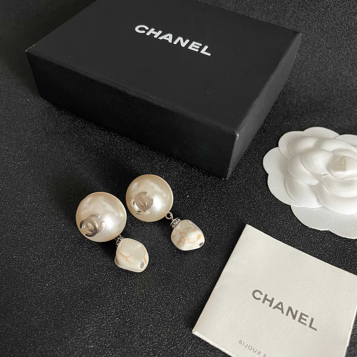 Martin Graham earrings in polished metal-tone – close-up detail