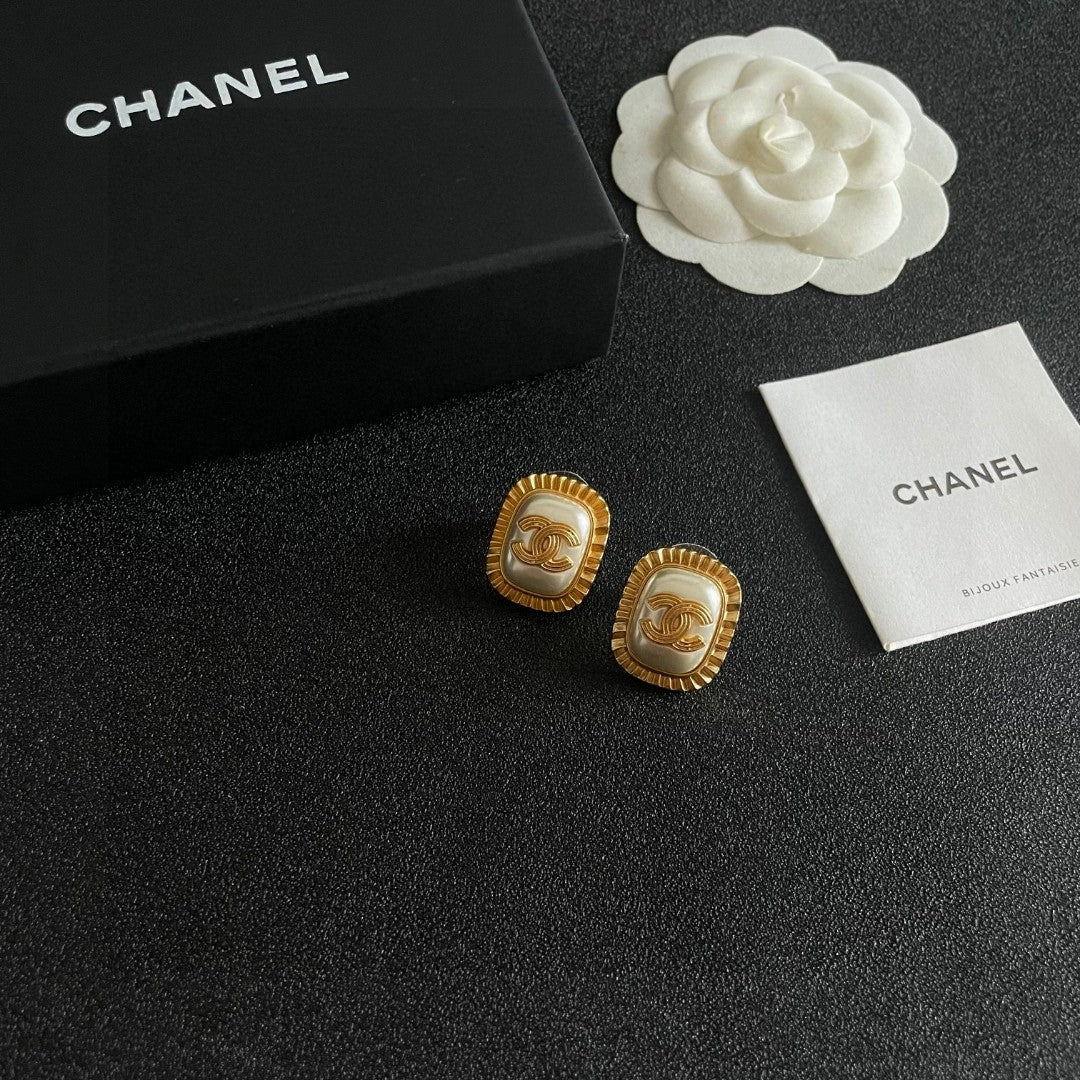 Martin Graham stud earrings in polished metal-tone – styled product view