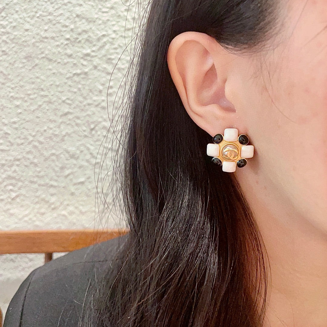 Martin Graham stud earrings in polished metal-tone – detail view