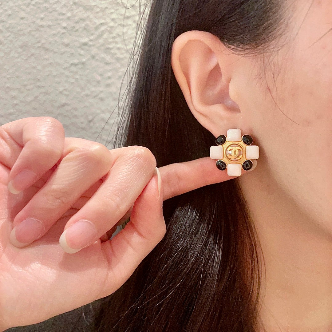 Martin Graham stud earrings in polished metal-tone – front product view