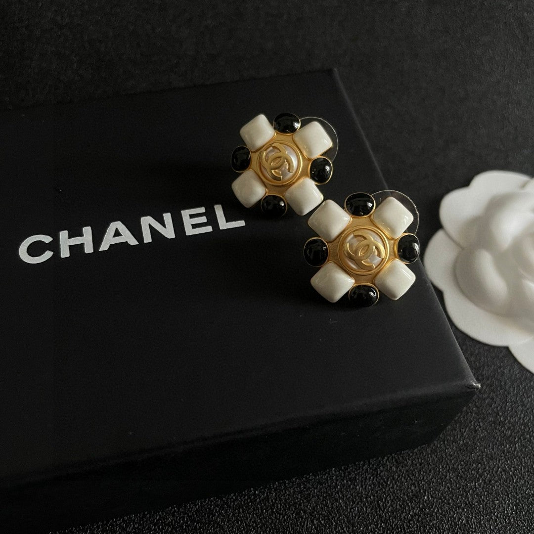 Martin Graham stud earrings in polished metal-tone – detail view