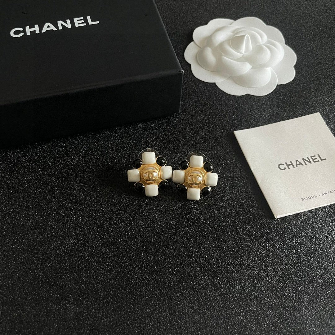 Martin Graham stud earrings in polished metal-tone – styled product view