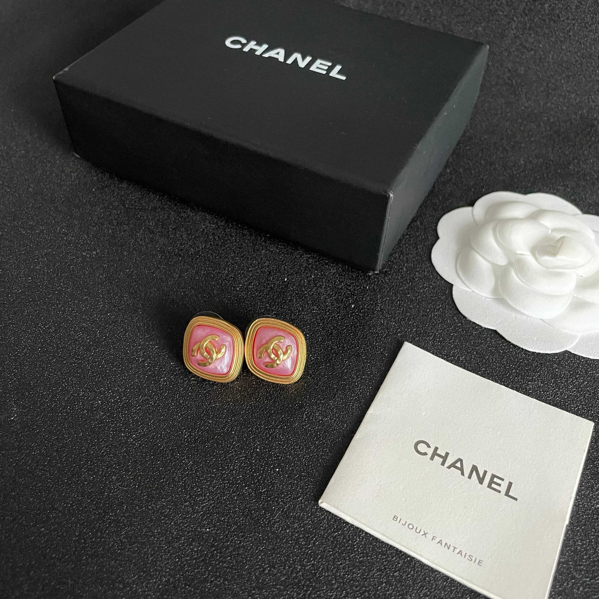 Martin Graham stud earrings in polished metal-tone – close-up detail