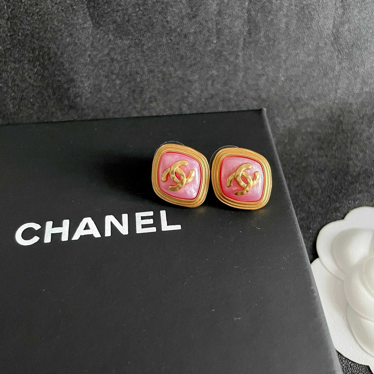 Martin Graham stud earrings in polished metal-tone – detail view
