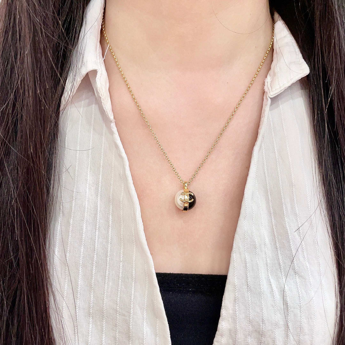 Martin Graham pendant necklace in polished metal-tone – detail view