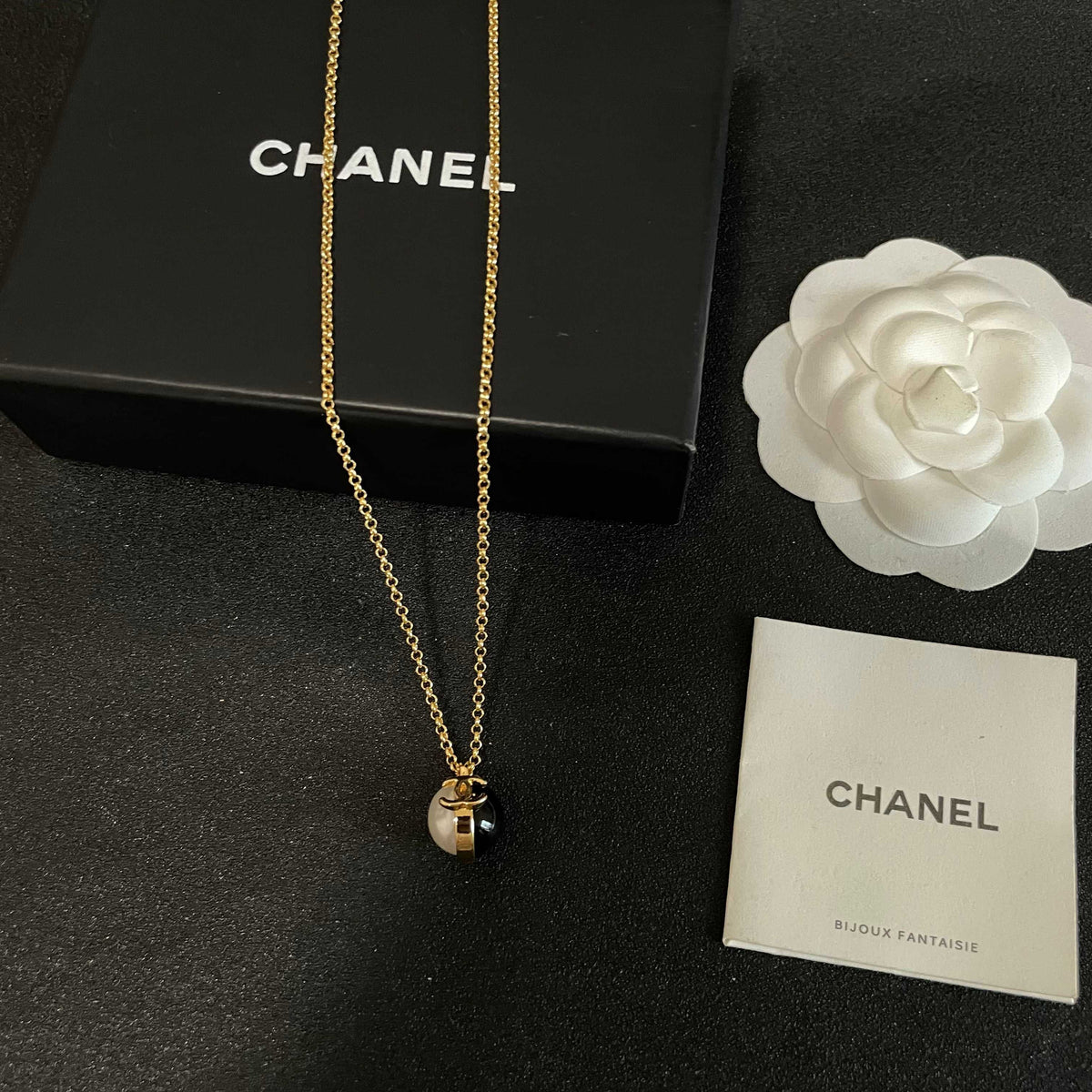 Martin Graham pendant necklace in polished metal-tone – close-up detail