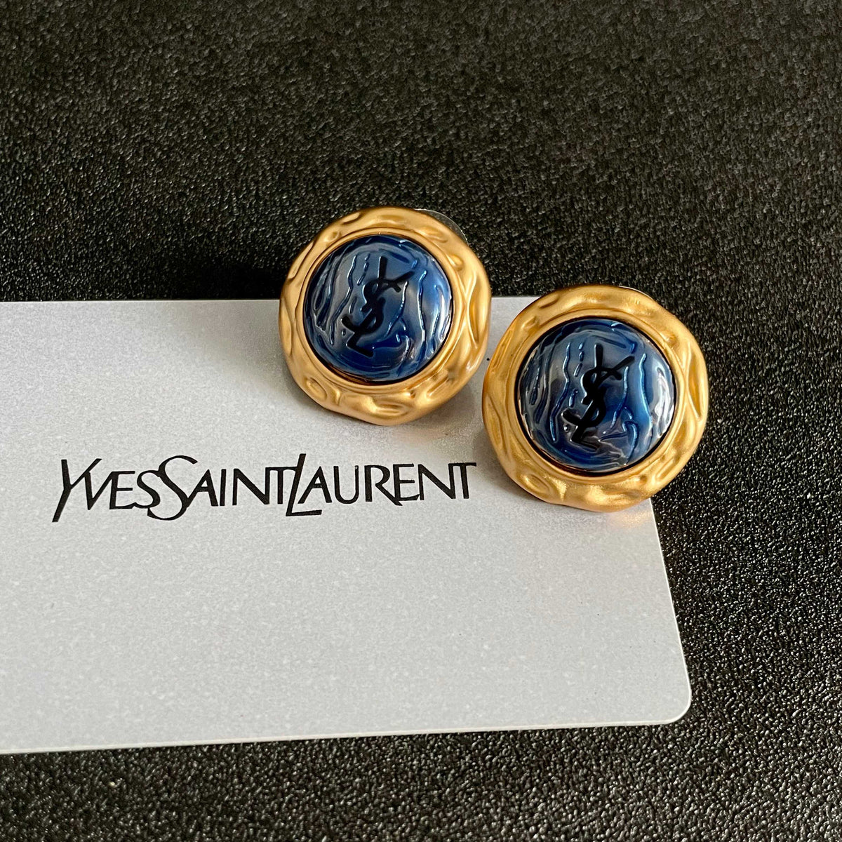 Martin Graham stud earrings in polished metal-tone – front product view