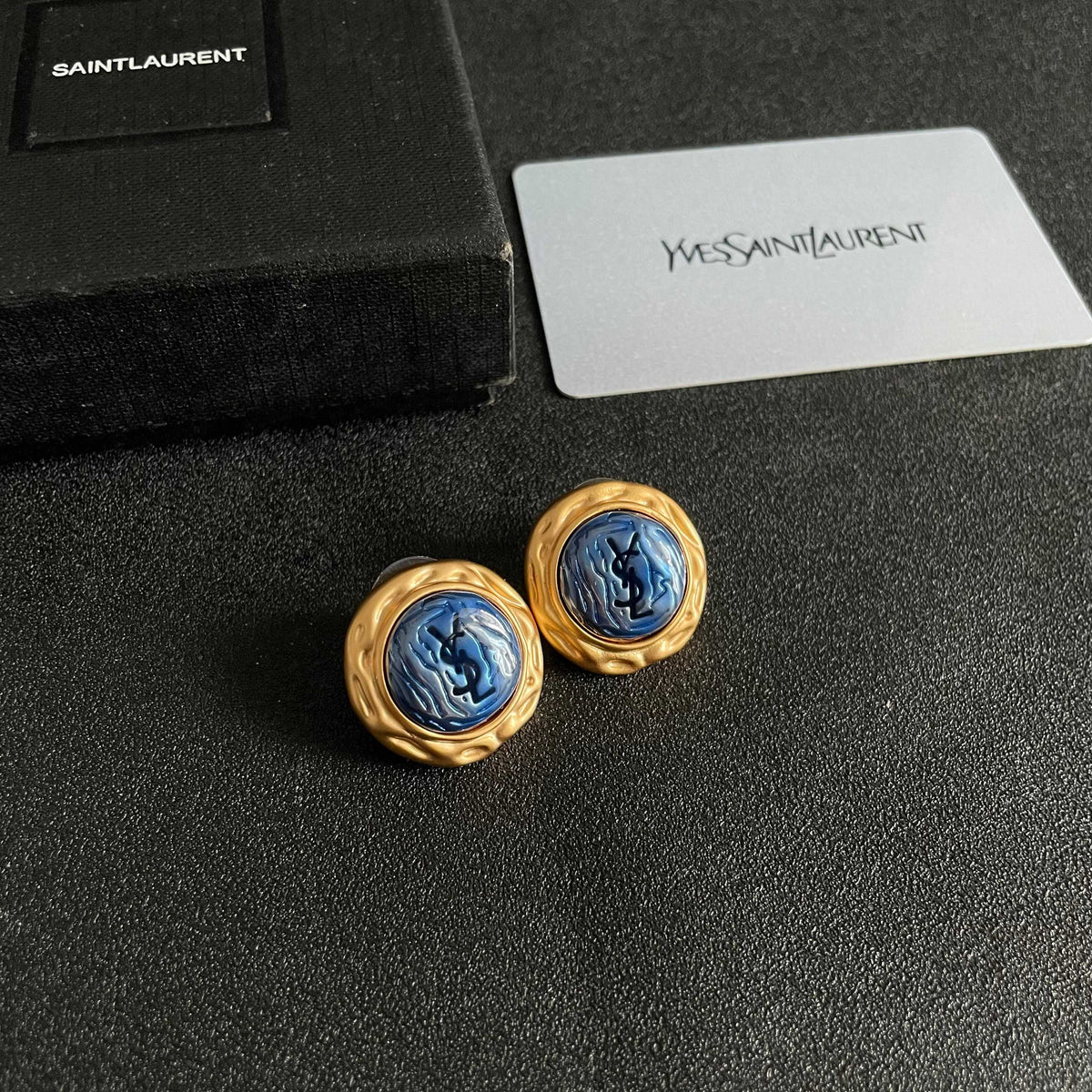 Martin Graham stud earrings in polished metal-tone – styled product view
