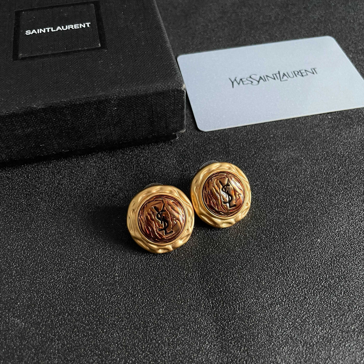 Martin Graham stud earrings in polished metal-tone – styled product view