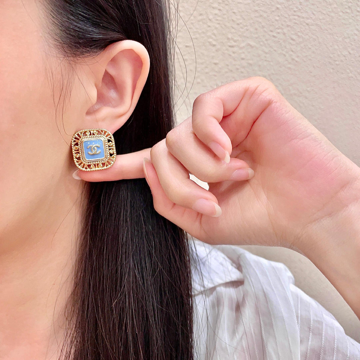 Martin Graham stud earrings in polished metal-tone – front product view