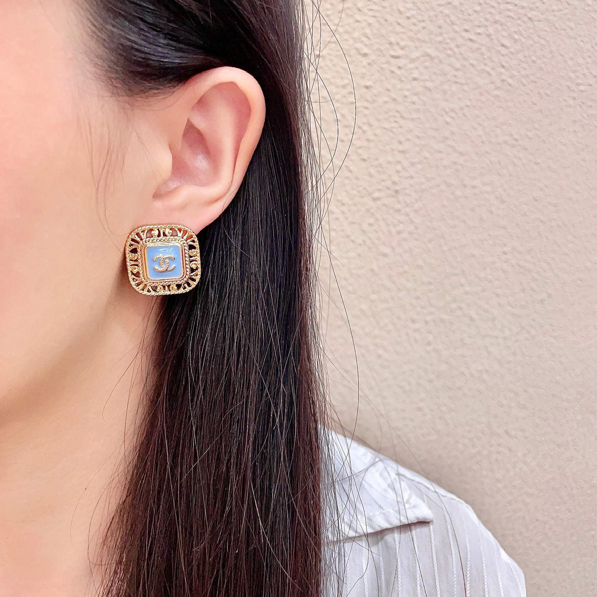 Martin Graham stud earrings in polished metal-tone – detail view