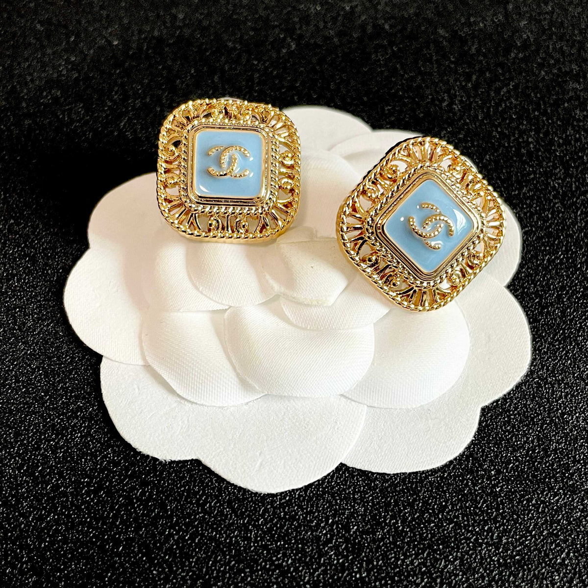 Martin Graham stud earrings in polished metal-tone – front product view
