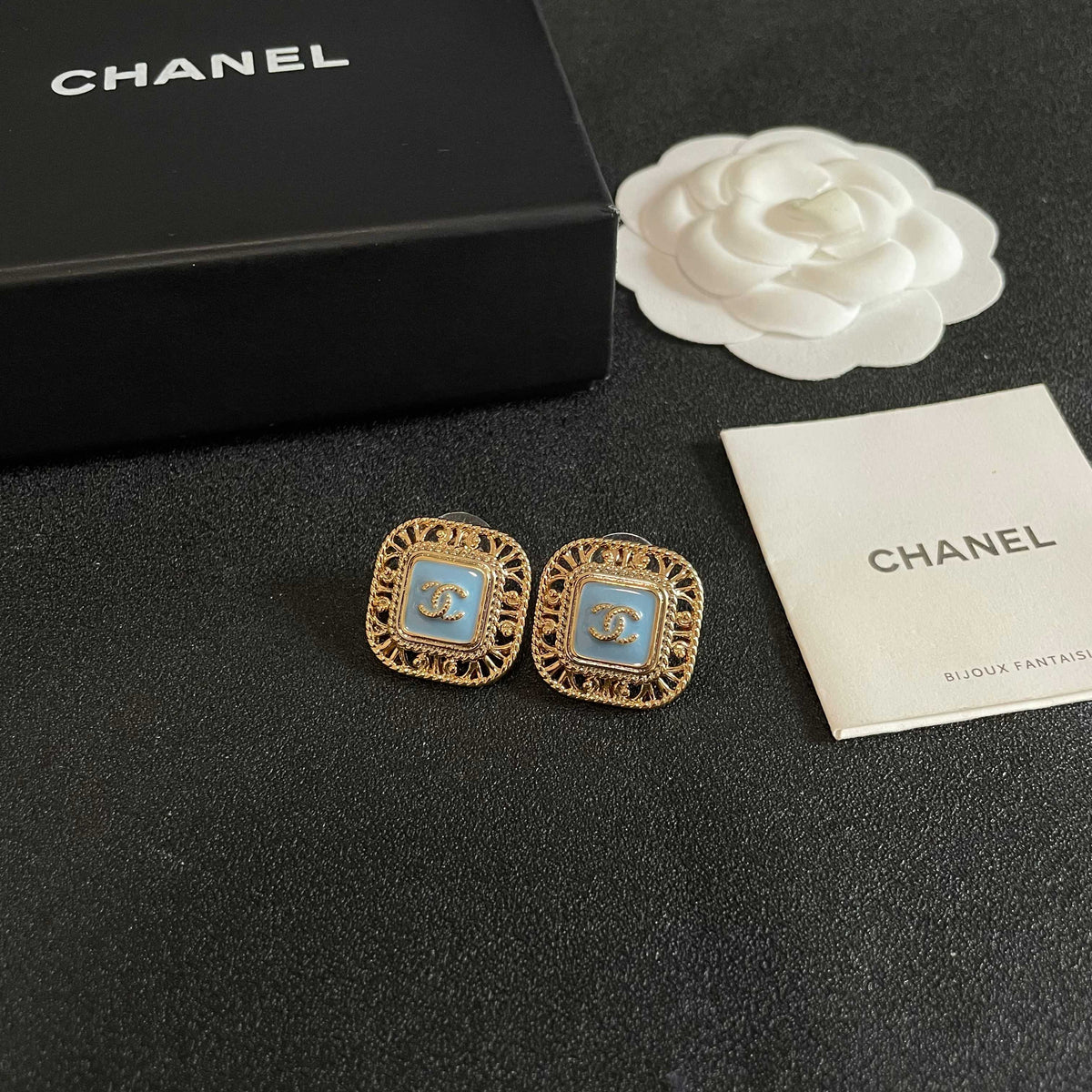 Martin Graham stud earrings in polished metal-tone – styled product view