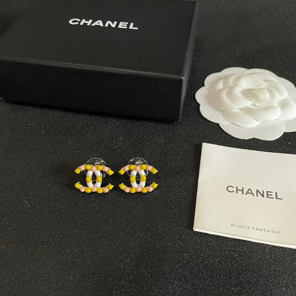 Martin Graham stud earrings in polished metal-tone – close-up detail