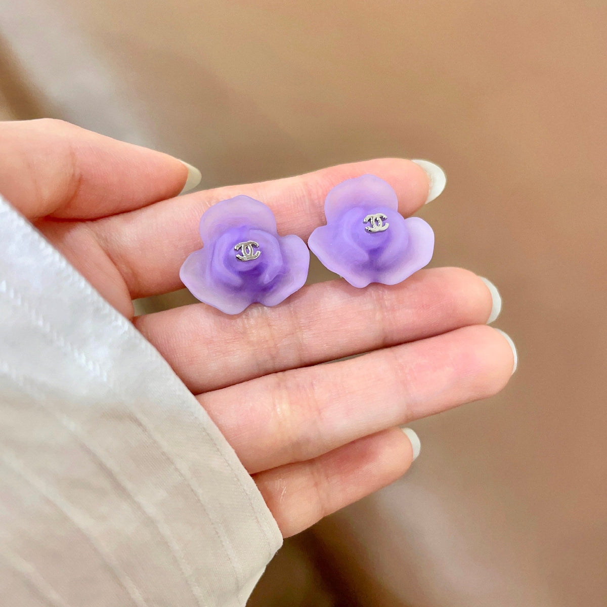 Martin Graham stud earrings in polished metal-tone – side detail