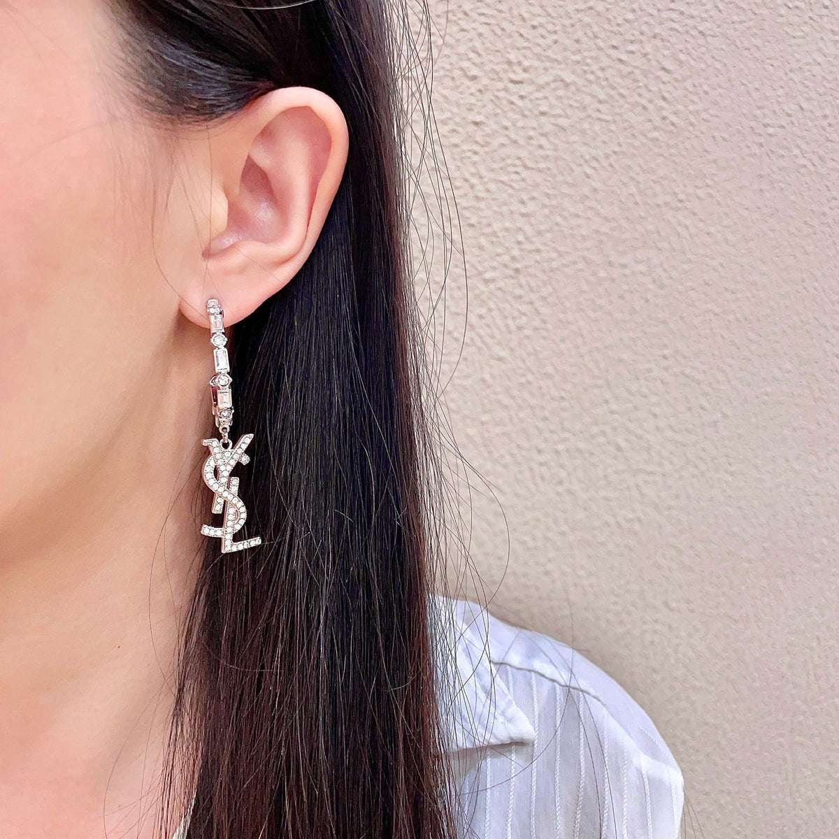 Martin Graham stud earrings in polished metal-tone – detail view