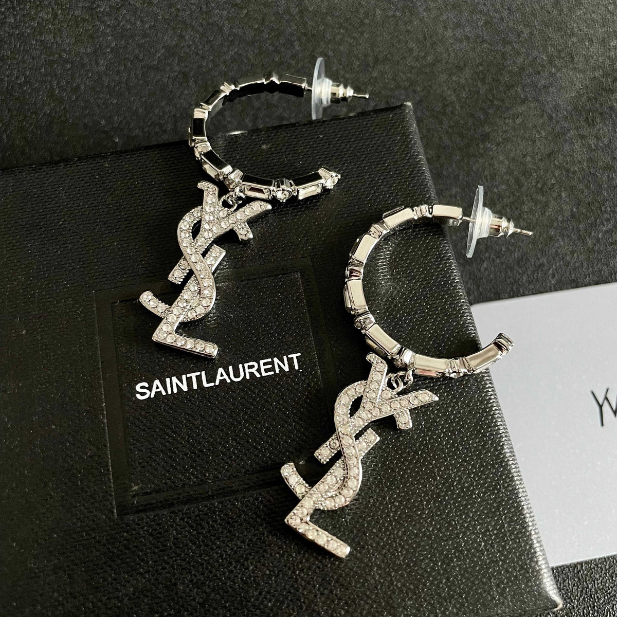 Martin Graham stud earrings in polished metal-tone – detail view