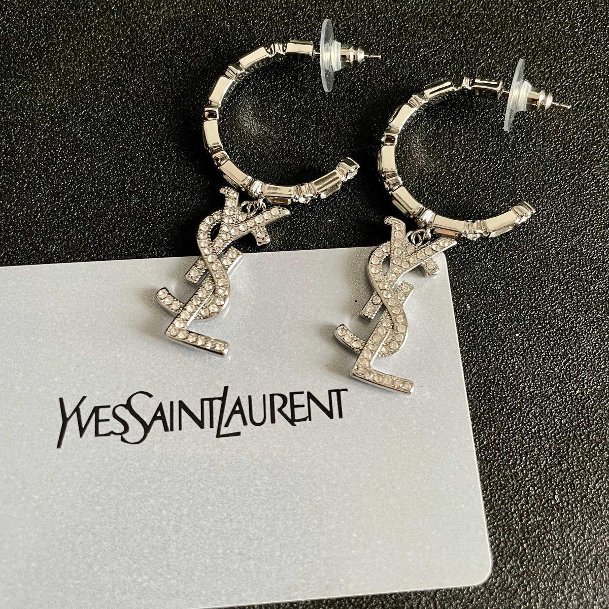 Martin Graham stud earrings in polished metal-tone – front product view
