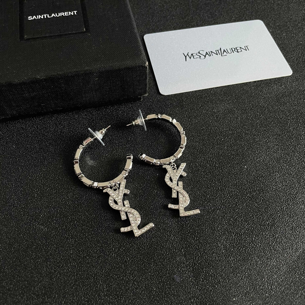 Martin Graham stud earrings in polished metal-tone – styled product view