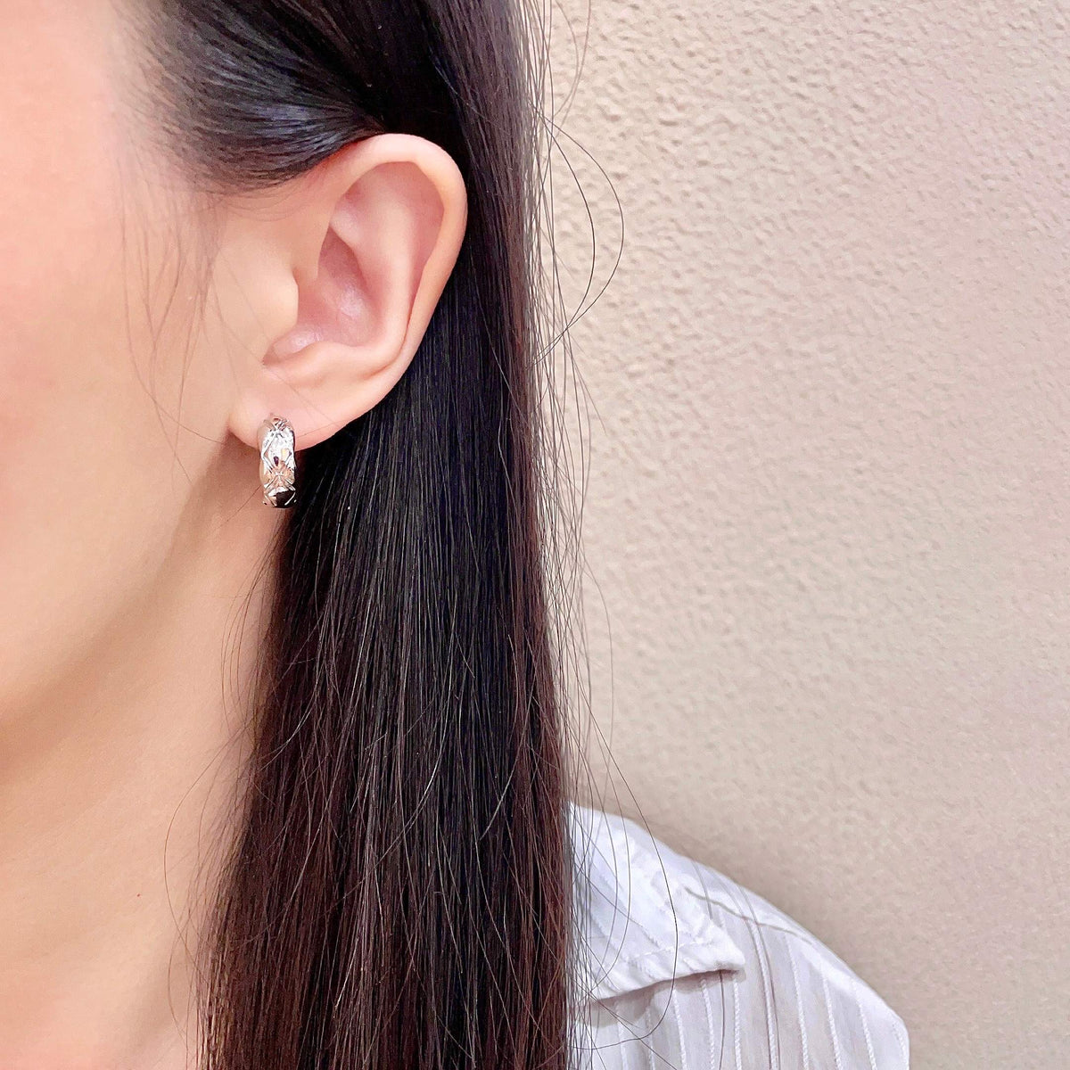 Martin Graham stud earrings in polished metal-tone – detail view