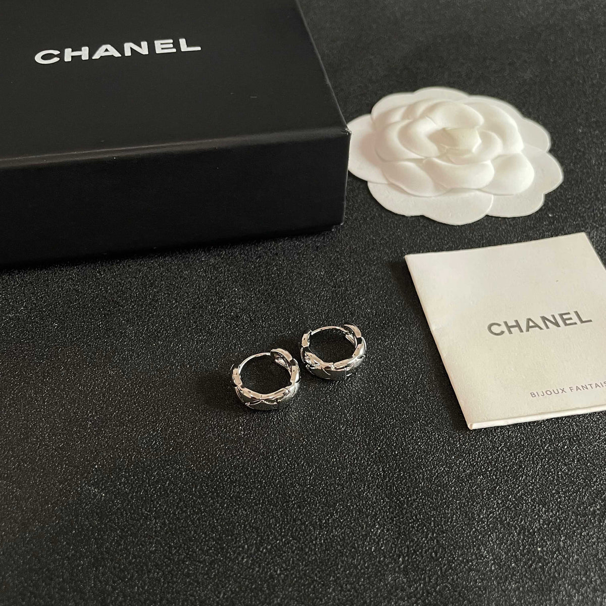 Martin Graham stud earrings in polished metal-tone – styled product view