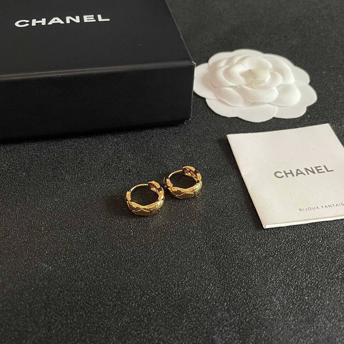 Martin Graham stud earrings in polished metal-tone – styled product view