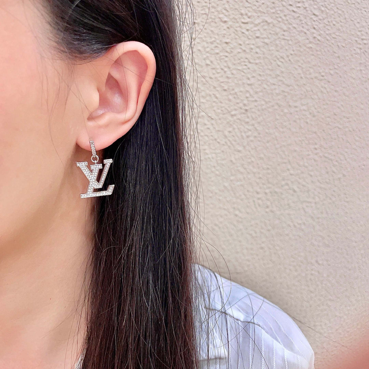 Martin Graham stud earrings in polished metal-tone – detail view