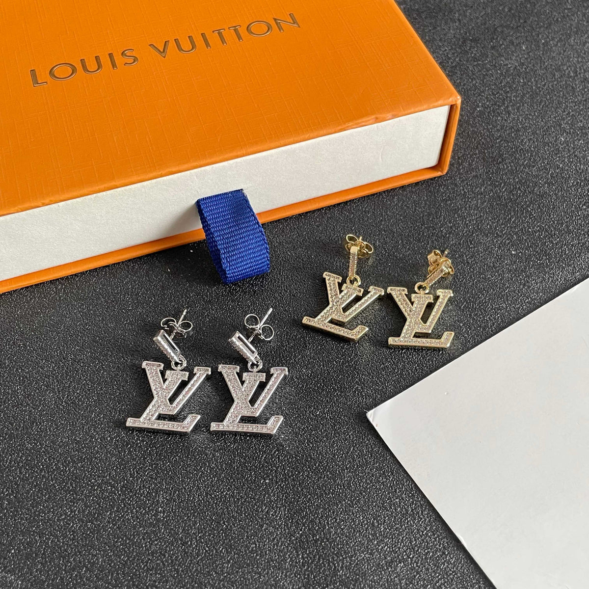 Martin Graham stud earrings in polished metal-tone – side detail
