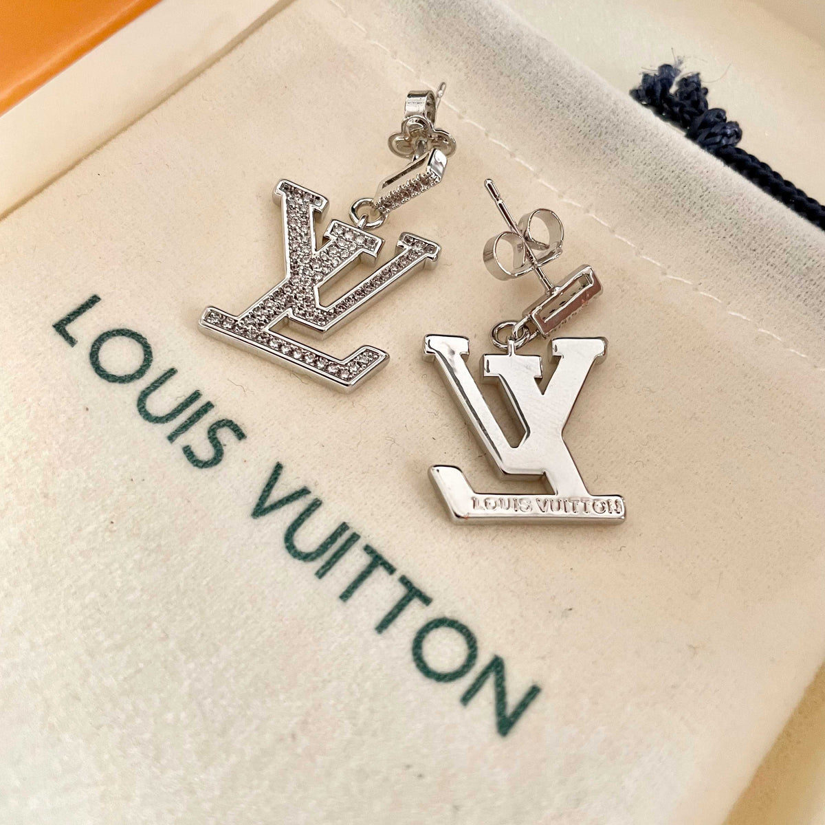 Martin Graham stud earrings in polished metal-tone – front product view