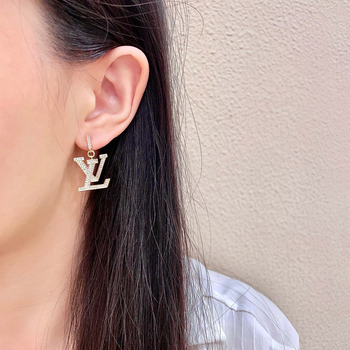 Martin Graham stud earrings in polished metal-tone – detail view