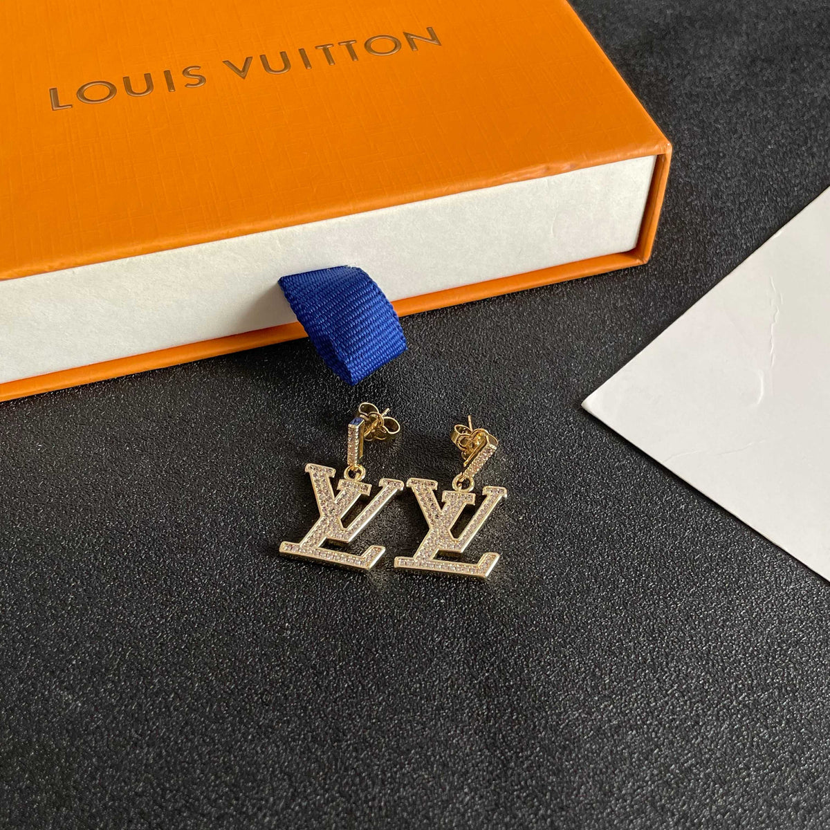Martin Graham stud earrings in polished metal-tone – close-up detail