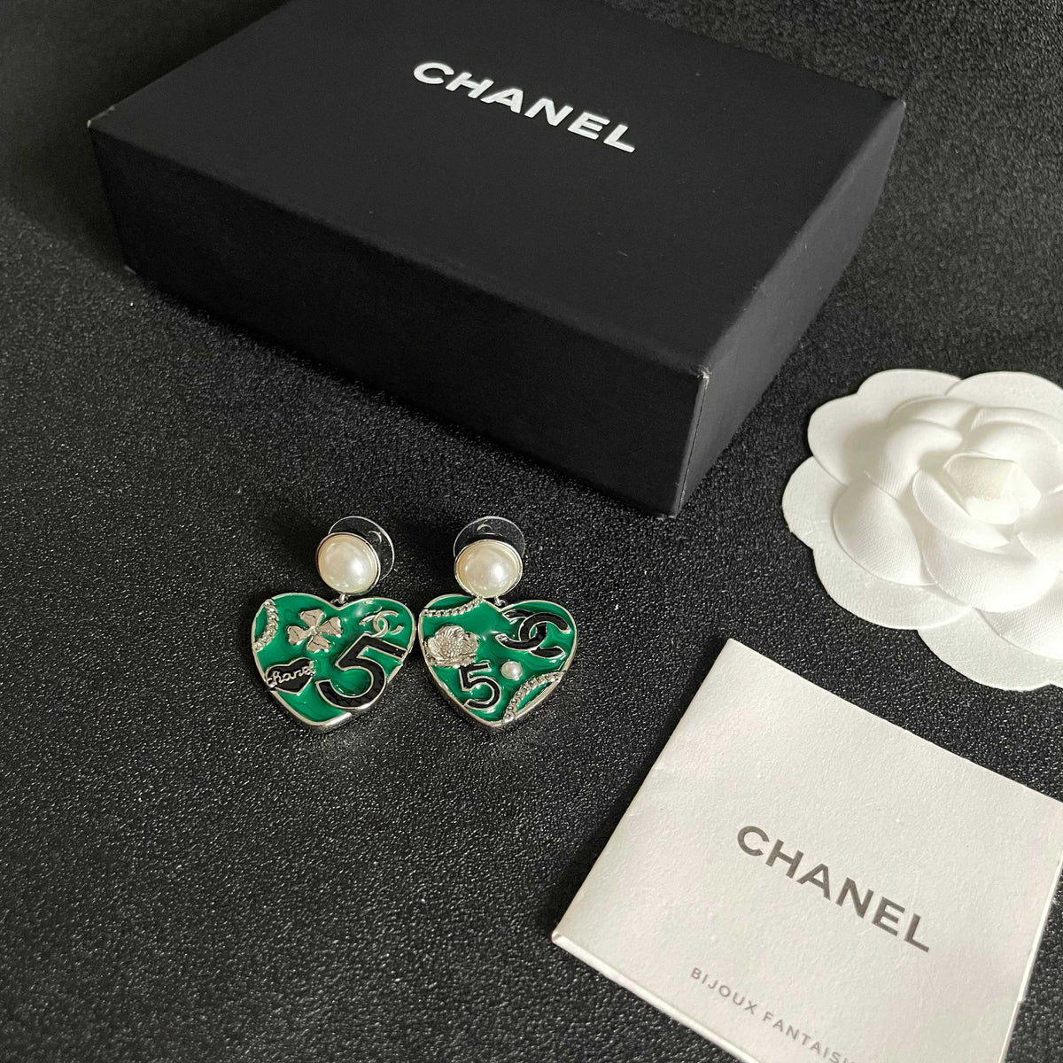 Martin Graham earrings in polished metal-tone – close-up detail