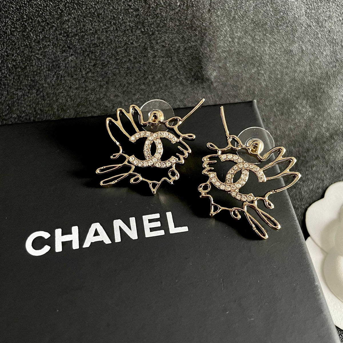 Martin Graham stud earrings in polished metal-tone – detail view