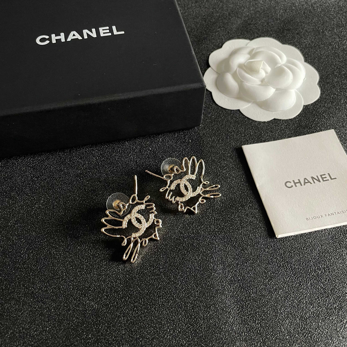 Martin Graham stud earrings in polished metal-tone – styled product view