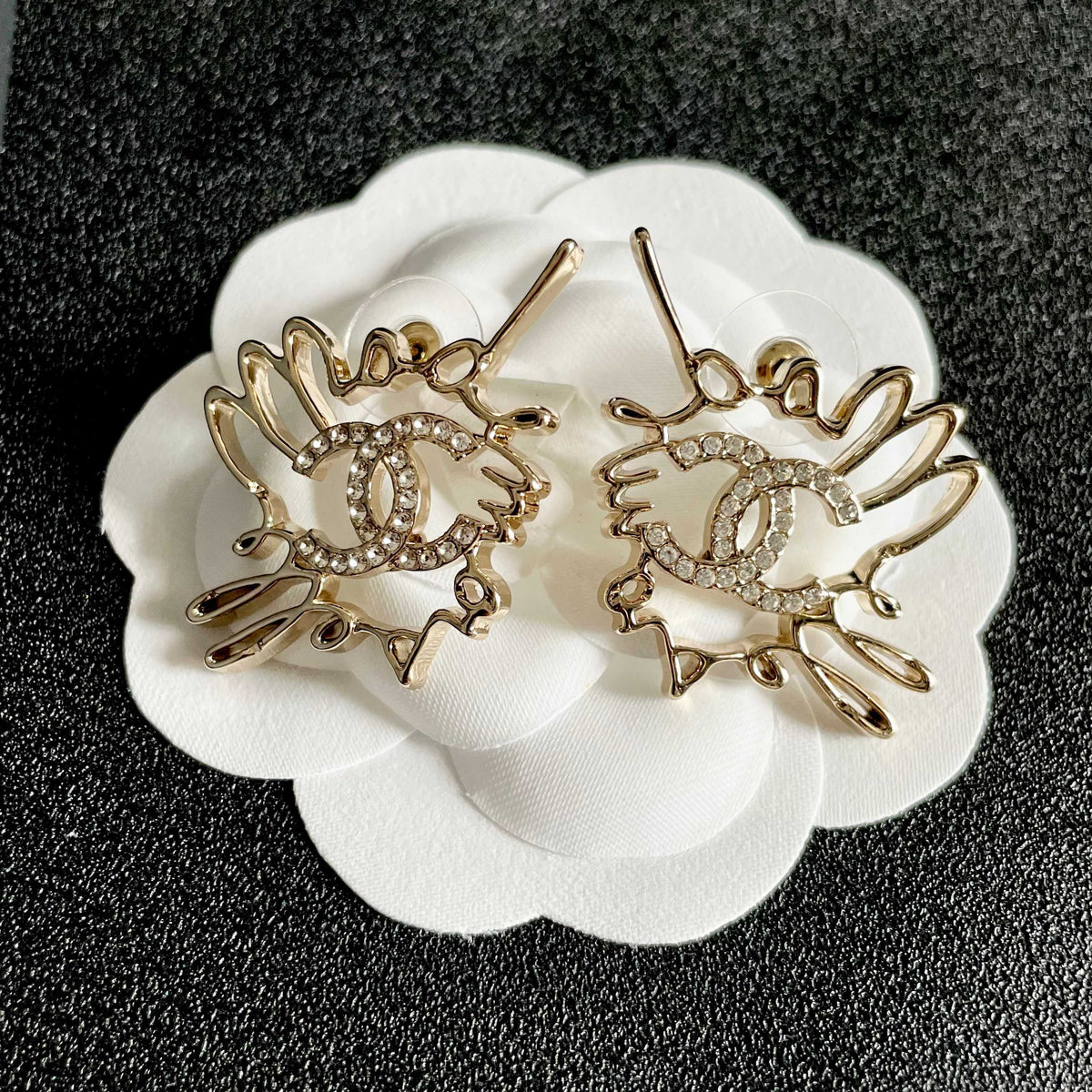 Martin Graham stud earrings in polished metal-tone – front product view