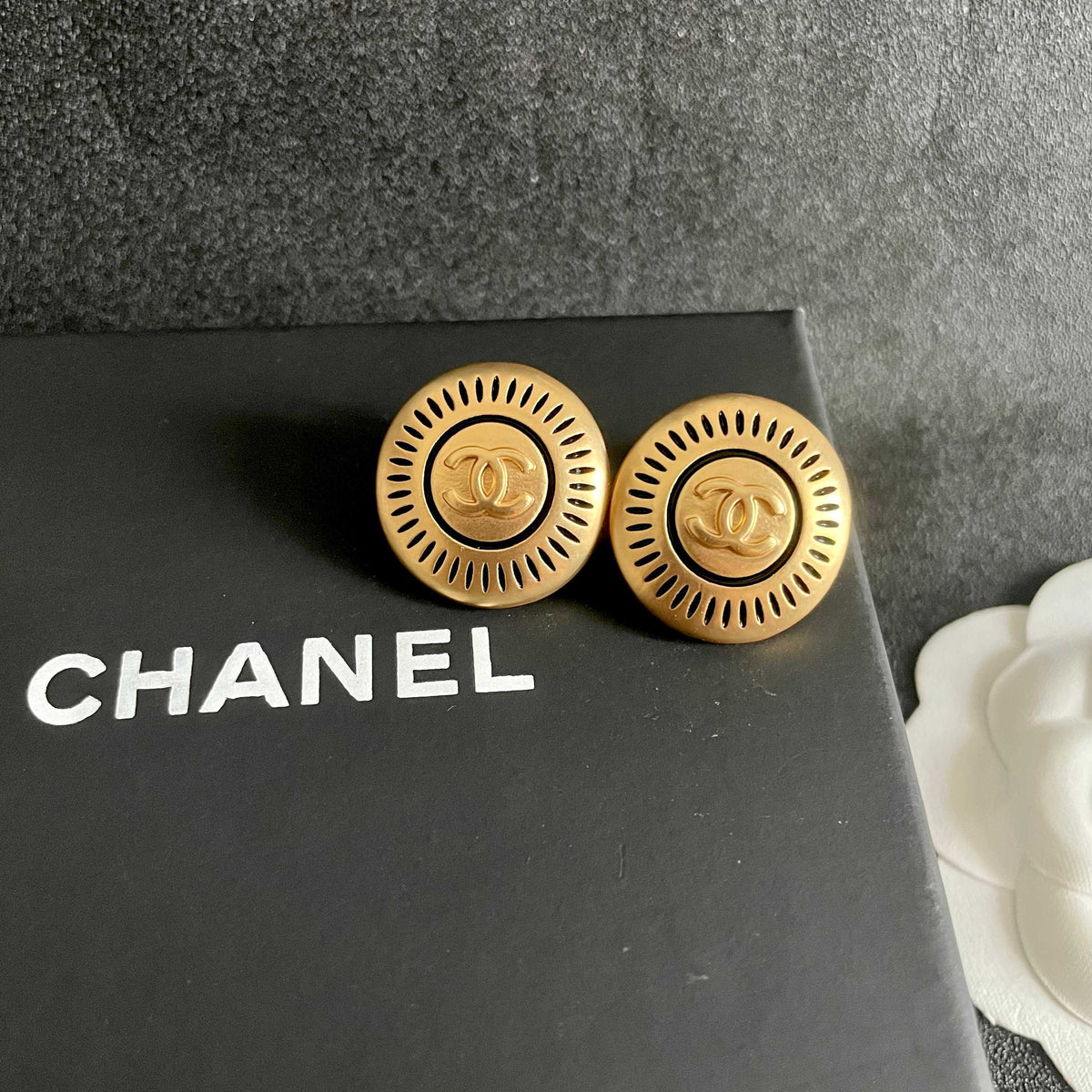 Martin Graham stud earrings in polished metal-tone – detail view