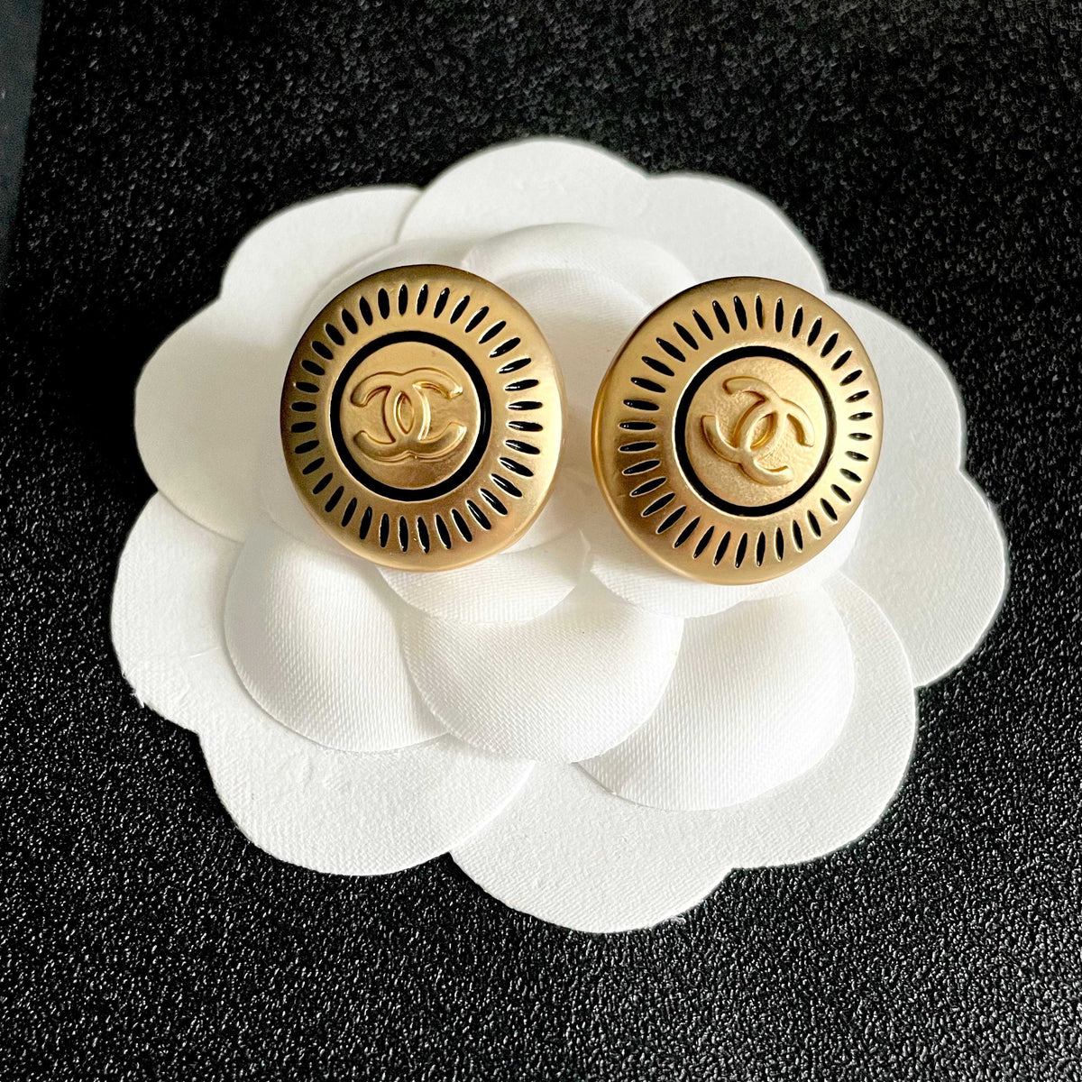 Martin Graham stud earrings in polished metal-tone – front product view