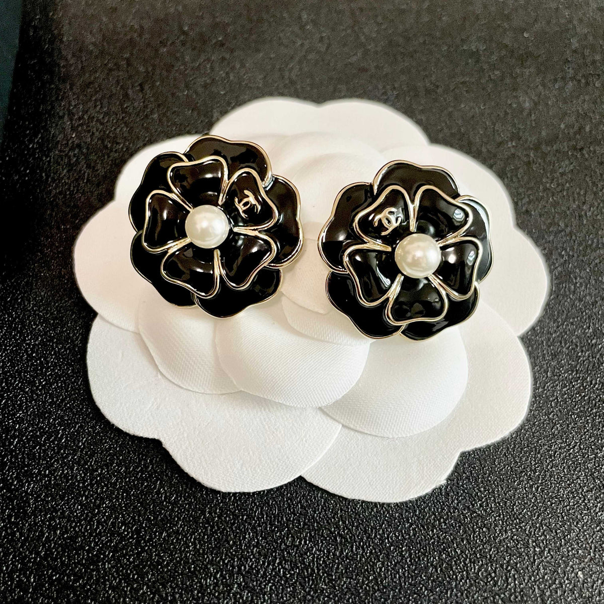 Martin Graham stud earrings in polished metal-tone – front product view