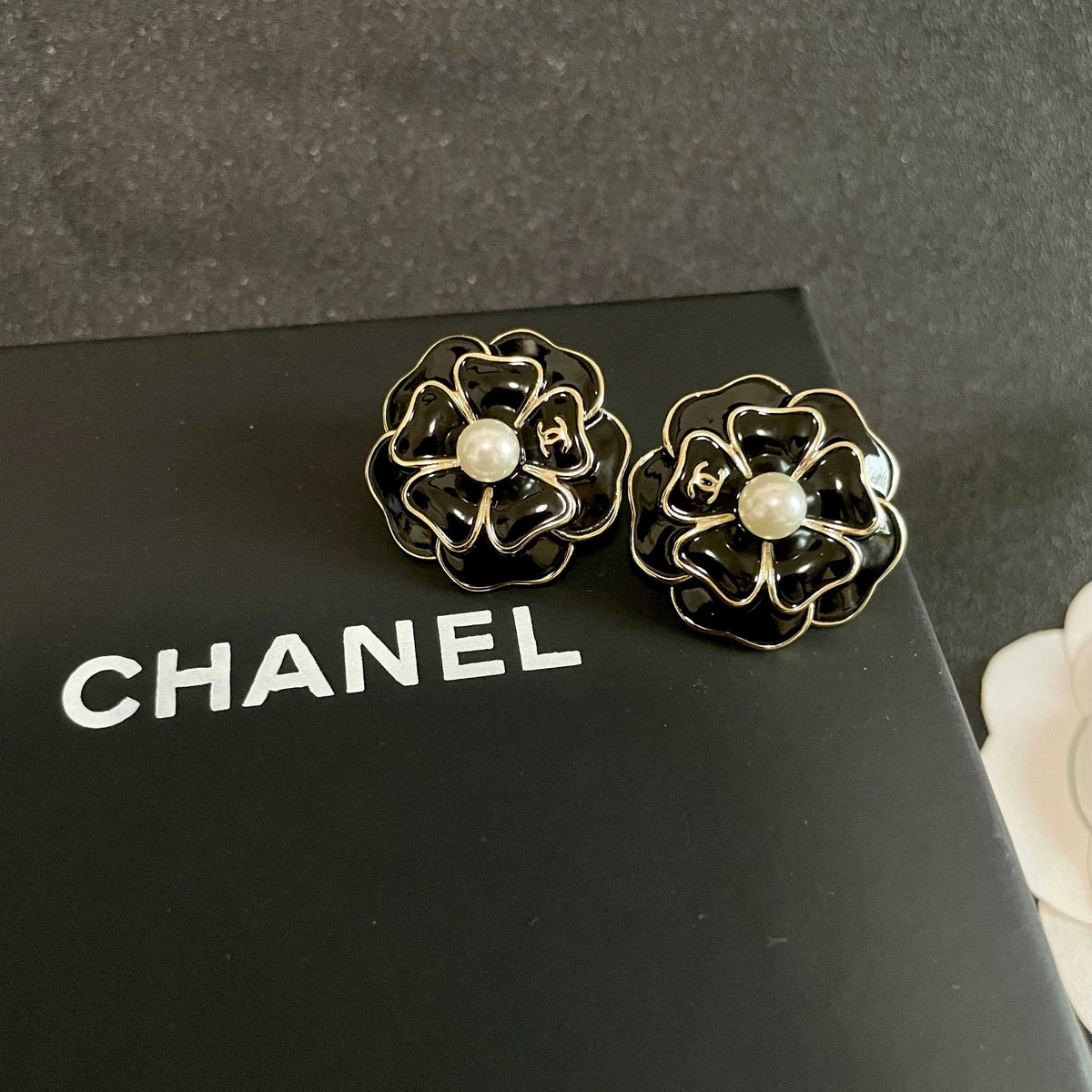 Martin Graham stud earrings in polished metal-tone – detail view