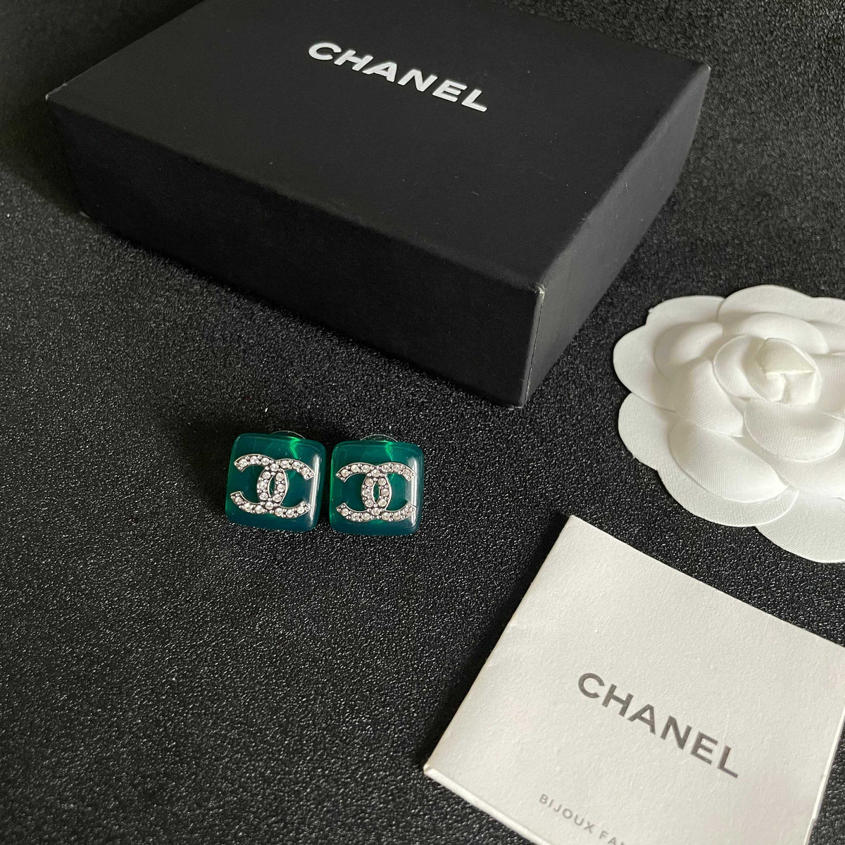 Martin Graham stud earrings in polished metal-tone – close-up detail