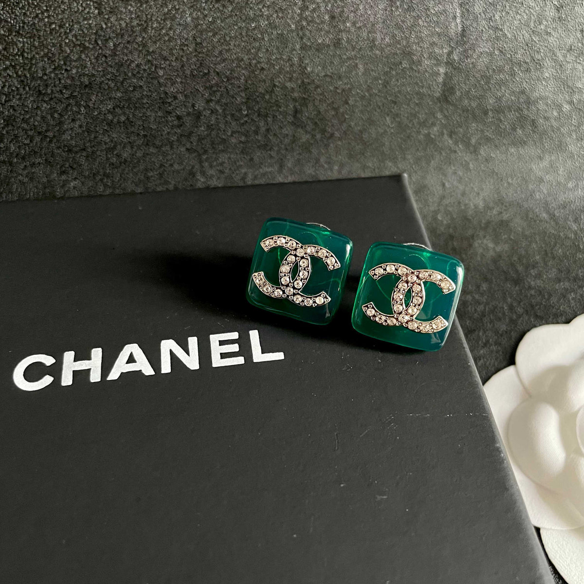 Martin Graham stud earrings in polished metal-tone – detail view