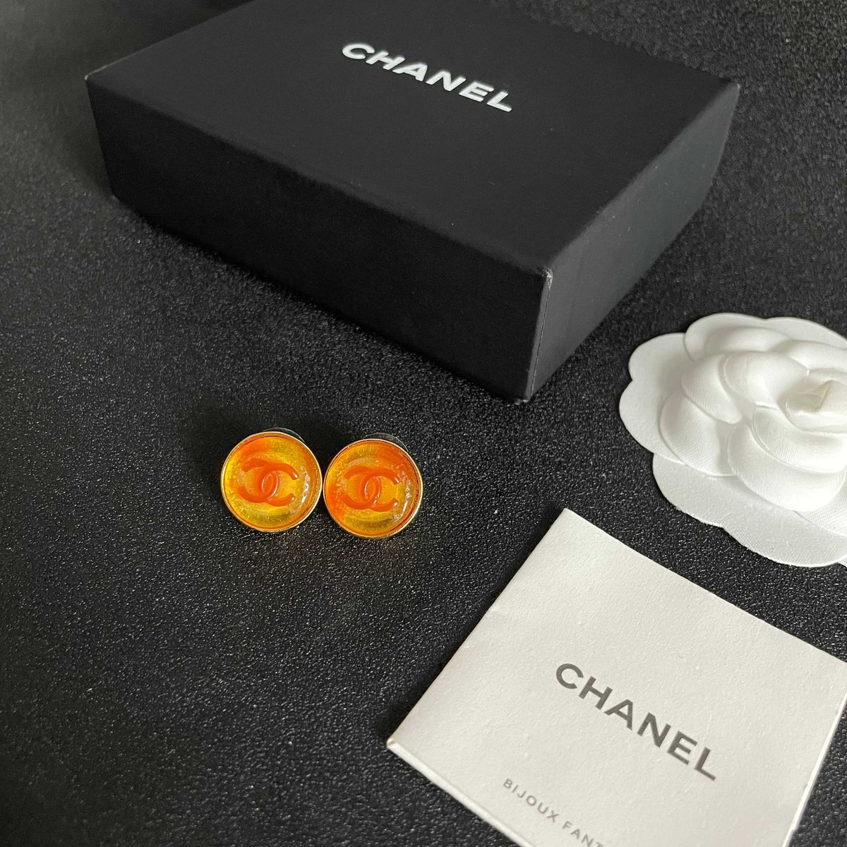 Martin Graham stud earrings in polished metal-tone – close-up detail