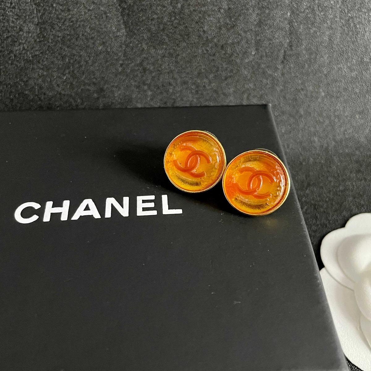 Martin Graham stud earrings in polished metal-tone – detail view