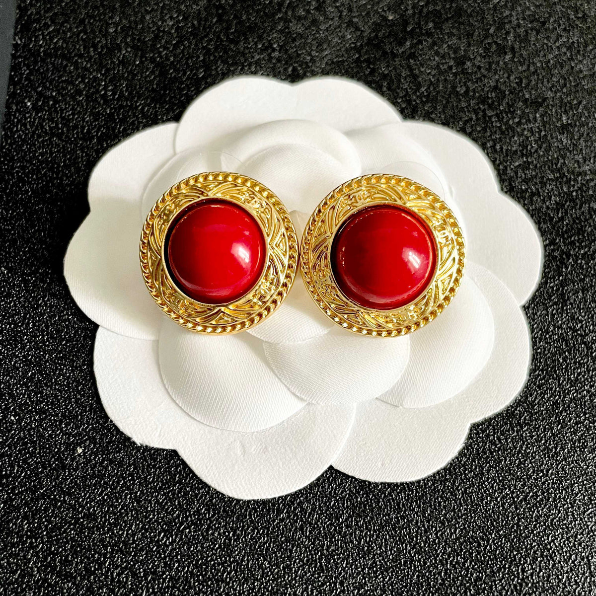 Martin Graham stud earrings in polished metal-tone – front product view