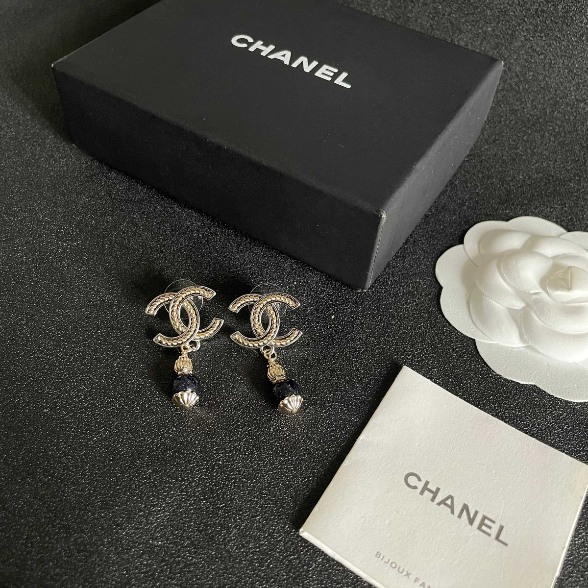 Martin Graham earrings in polished metal-tone – close-up detail