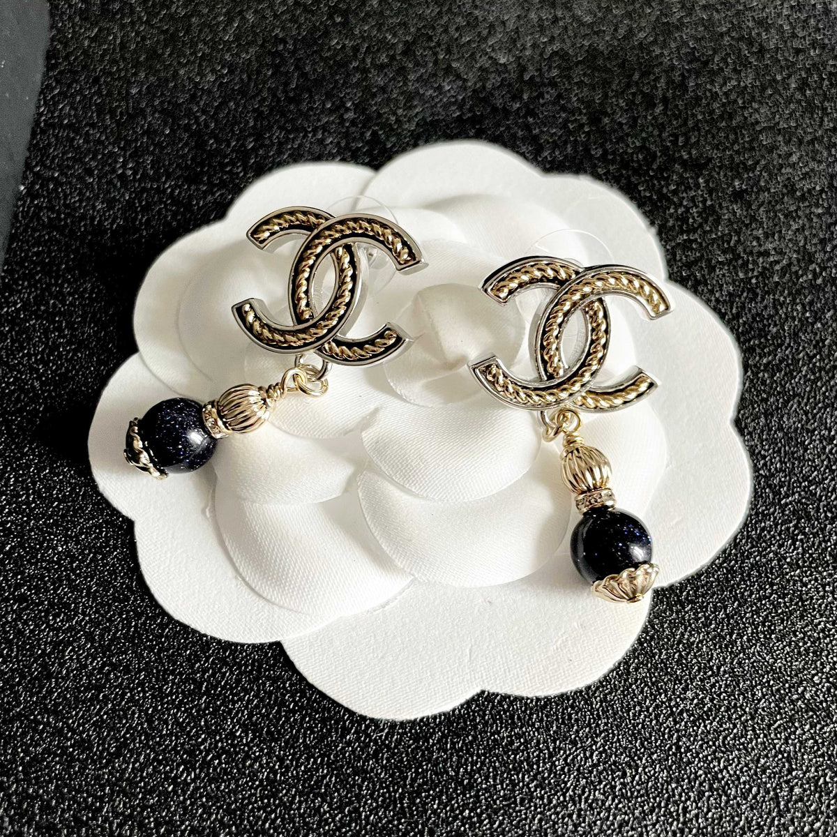Martin Graham earrings in polished metal-tone – front product view