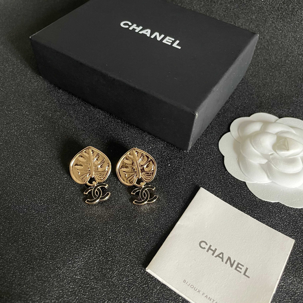 Martin Graham earrings in polished metal-tone – close-up detail